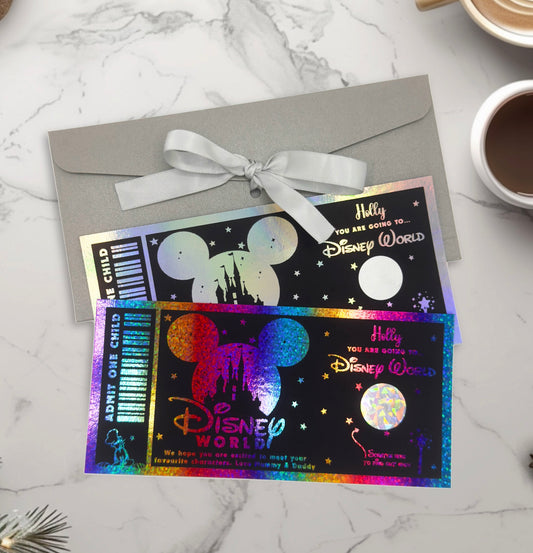 Disney World foil ticket design with colorful foil on a marble surface with a cup of coffee.