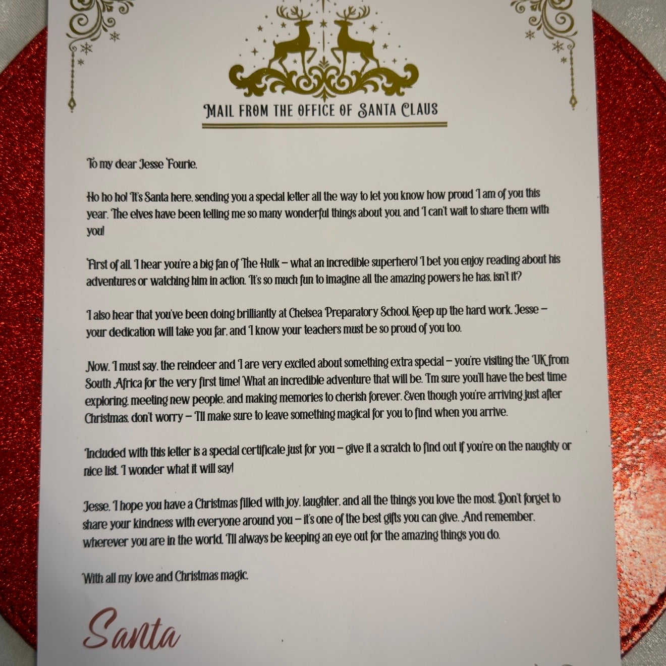 Letter from Santa Claus on a decorative red and gold background