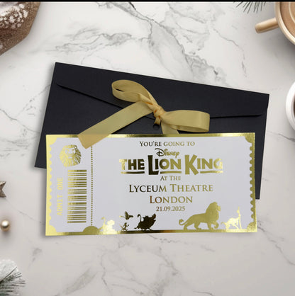 Invitation card for 'The Lion King' at the Lyceum Theatre London with a black envelope and gold ribbon.